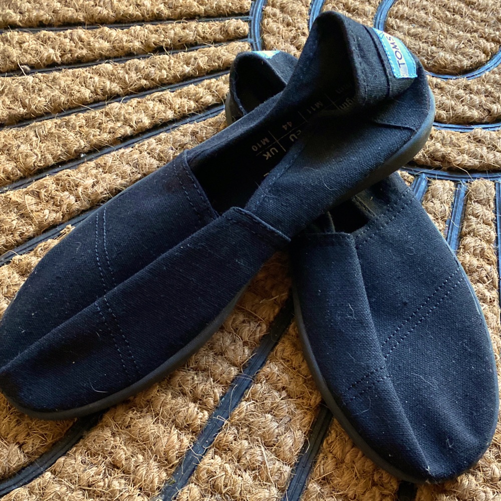 New Toms black slip ons